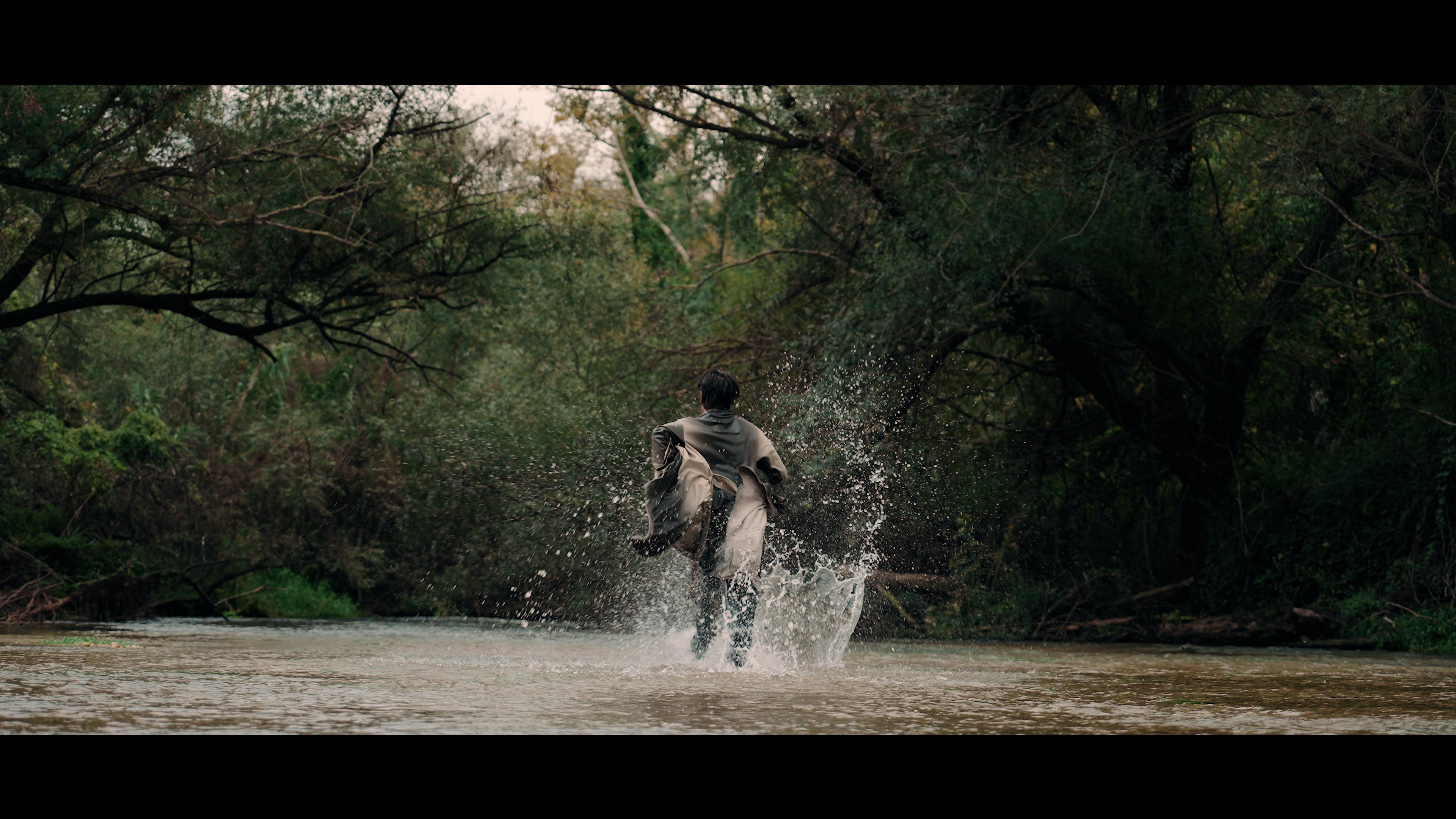 DANTE film still — running through the river